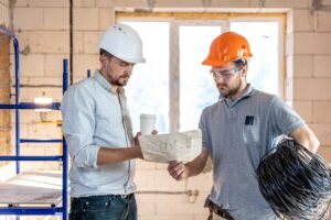 Two builders collaborate to build a new home.